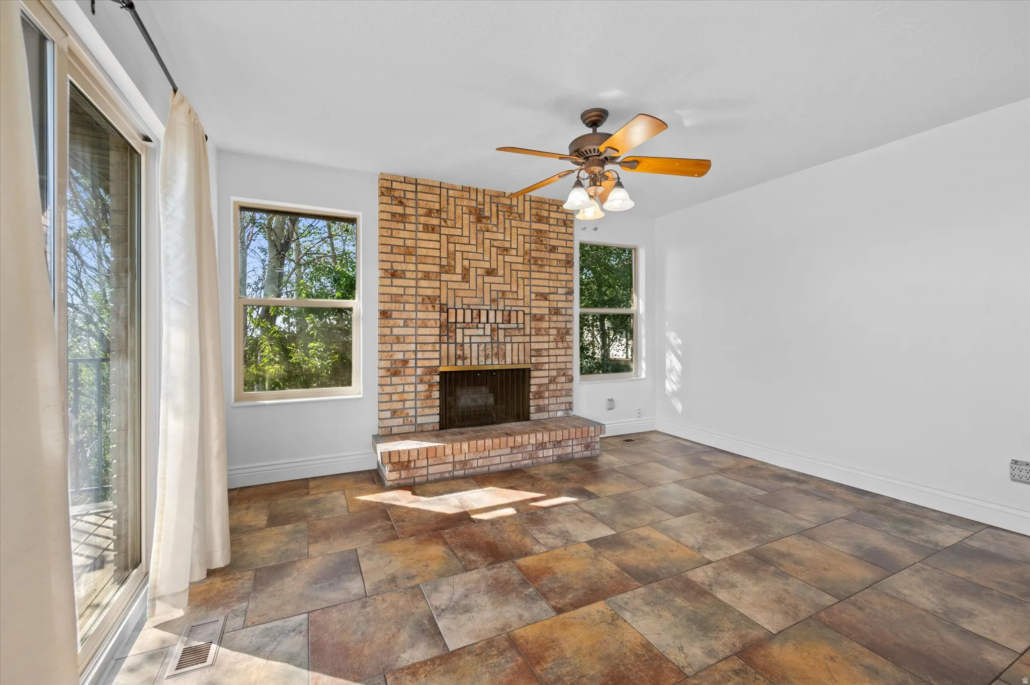 Kitchen w/breakfast nook and semi-formal dining and fireplace.