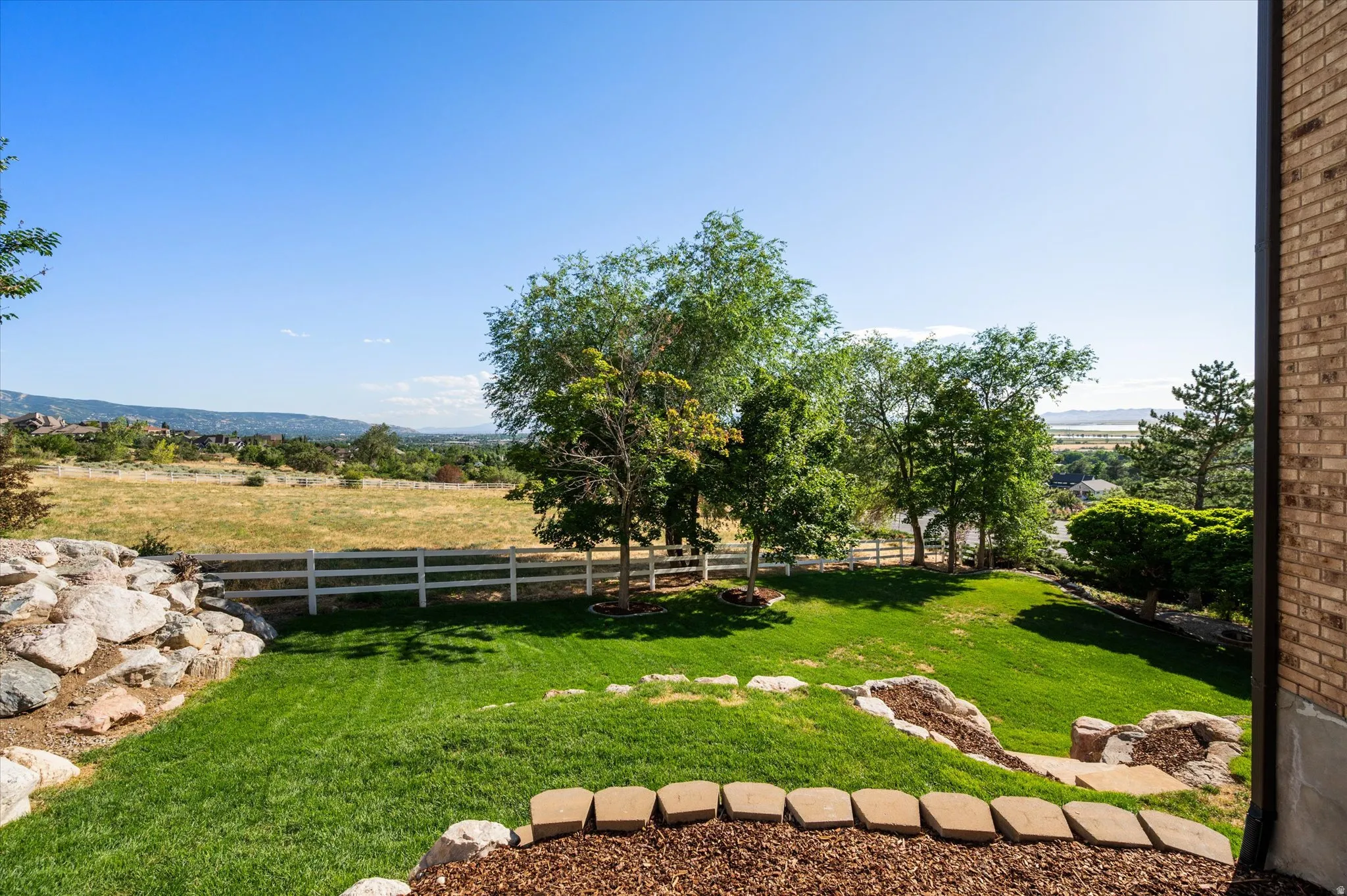 View of immaculate yard from south side of home.