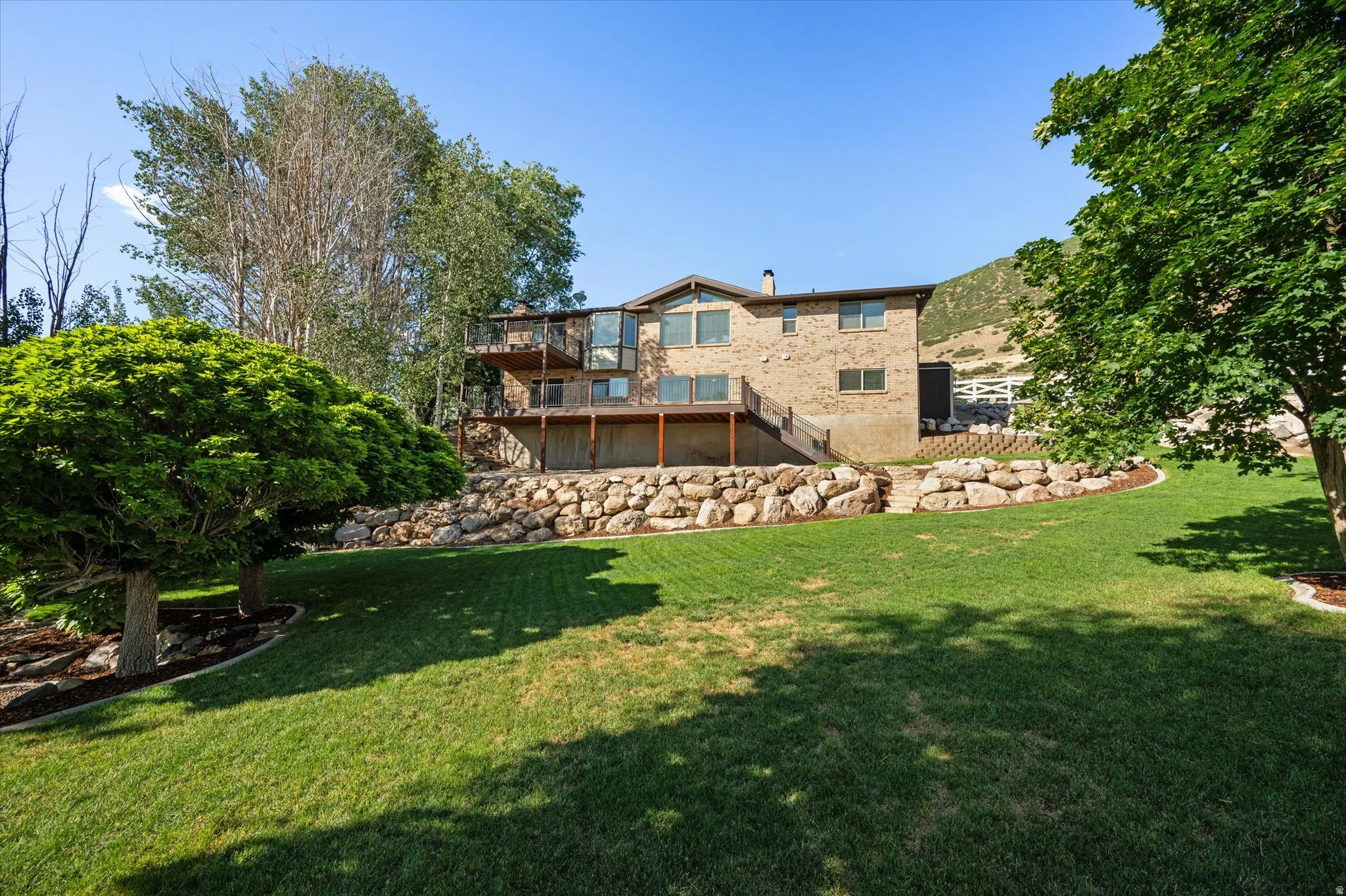 View of home from lower portion of backyard