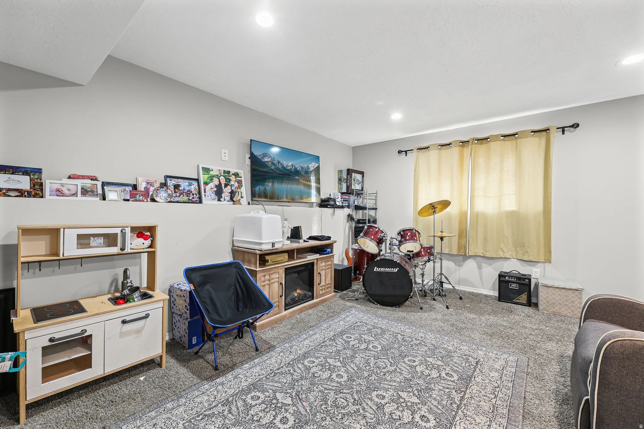Recessed ceiling lighting, light gray wall paint, and gray carpet flooring