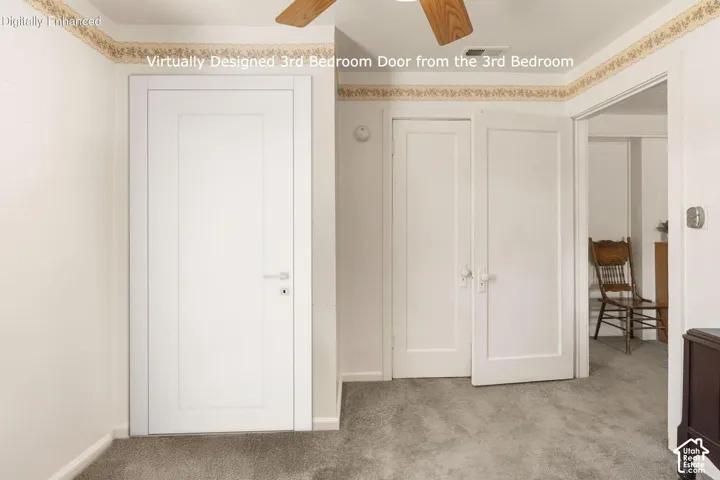 White paneled doors, wall-to-wall carpeting, and wood-finish ceiling fan