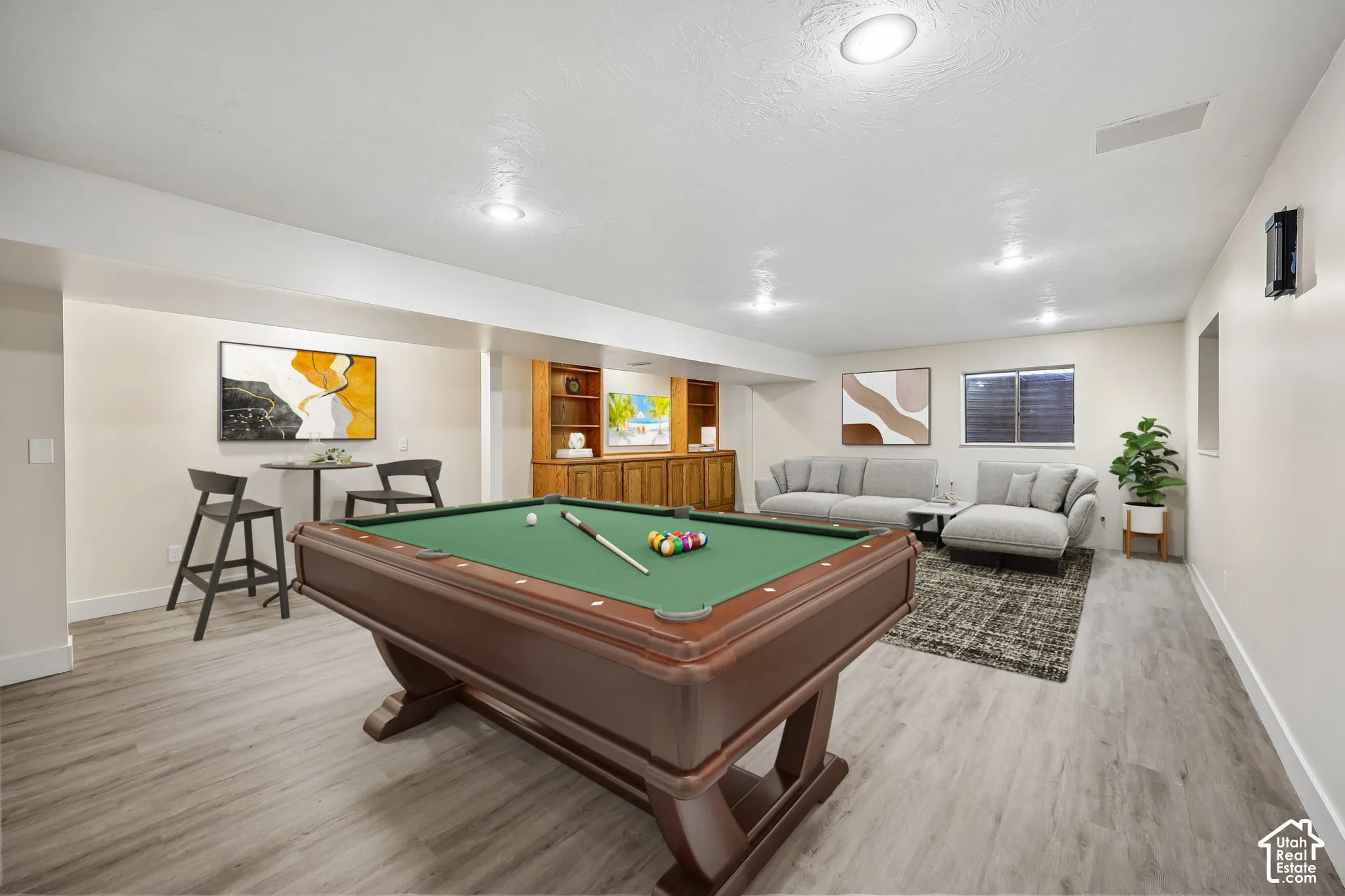 Recessed lighting, wood-finish flooring, and built-in cabinetry