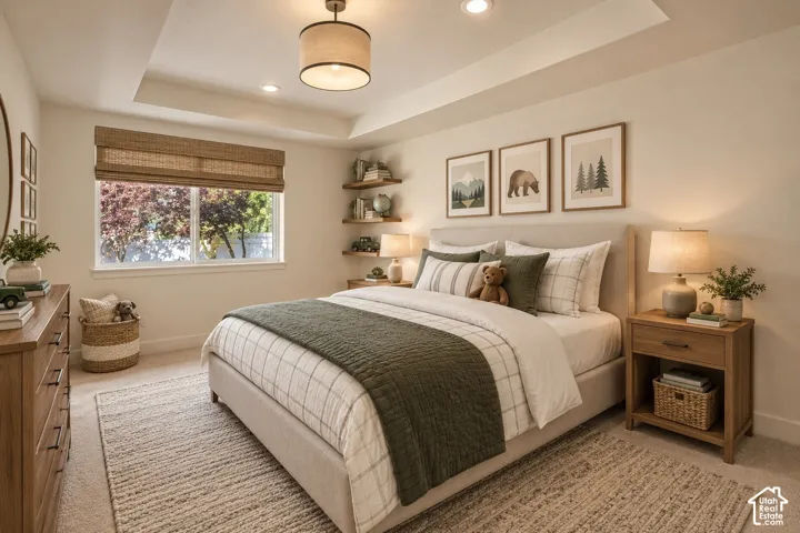 Bedroom featuring a tray ceiling, recessed lighting, central drum pendant fixture, natural woven window shades, and wall-mounted floating shelving