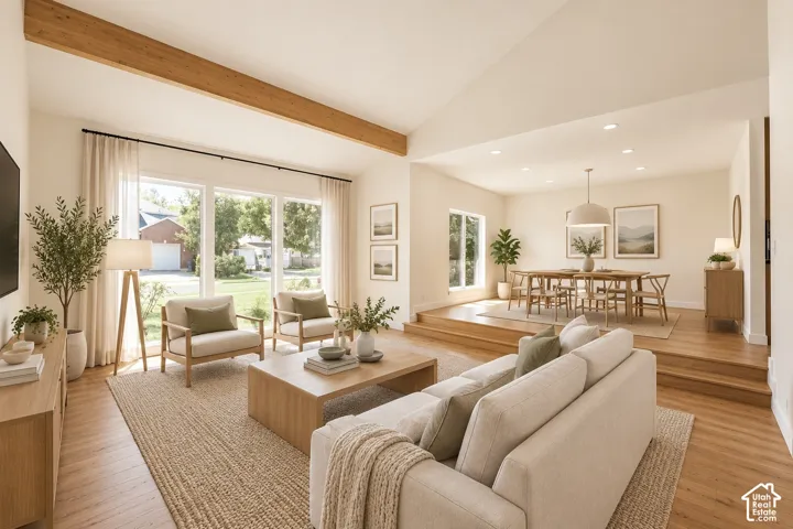 Vaulted ceiling featuring an exposed decorative wood beam, recessed lighting, wood-finish flooring, and multi-pane windows