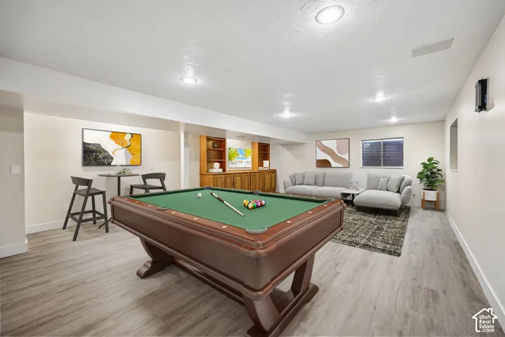 Recessed lighting, wood-finish flooring, and built-in cabinetry