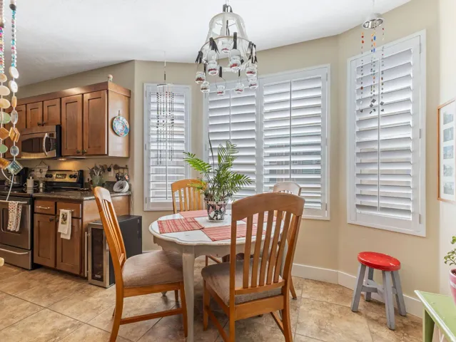Kitchen featuring wood cabinetry, stainless steel appliances, and a built-in microwave
