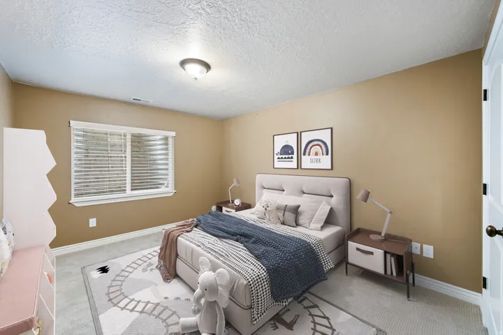 Neutral wall tones with white trim, carpeting, and a single light fixture
