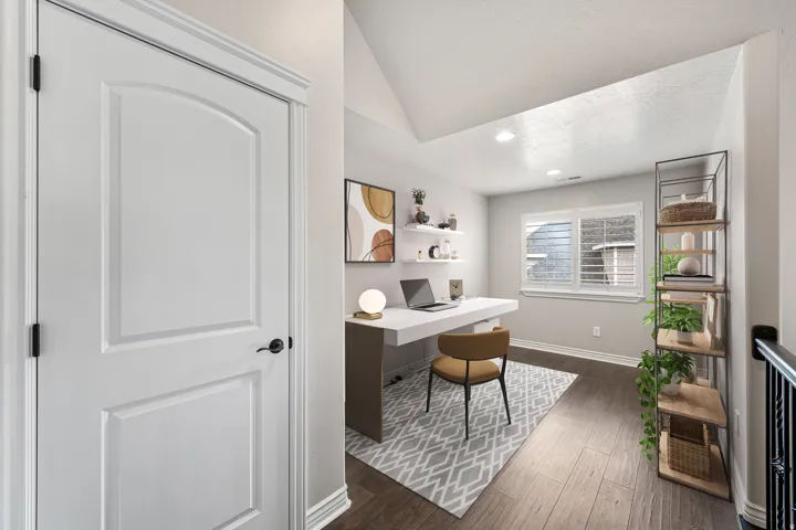 Wood-finish flooring, vaulted ceiling, recessed lighting, and a window with horizontal blinds