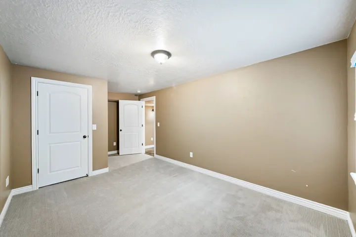 Neutral-toned walls complement light-colored carpeting
