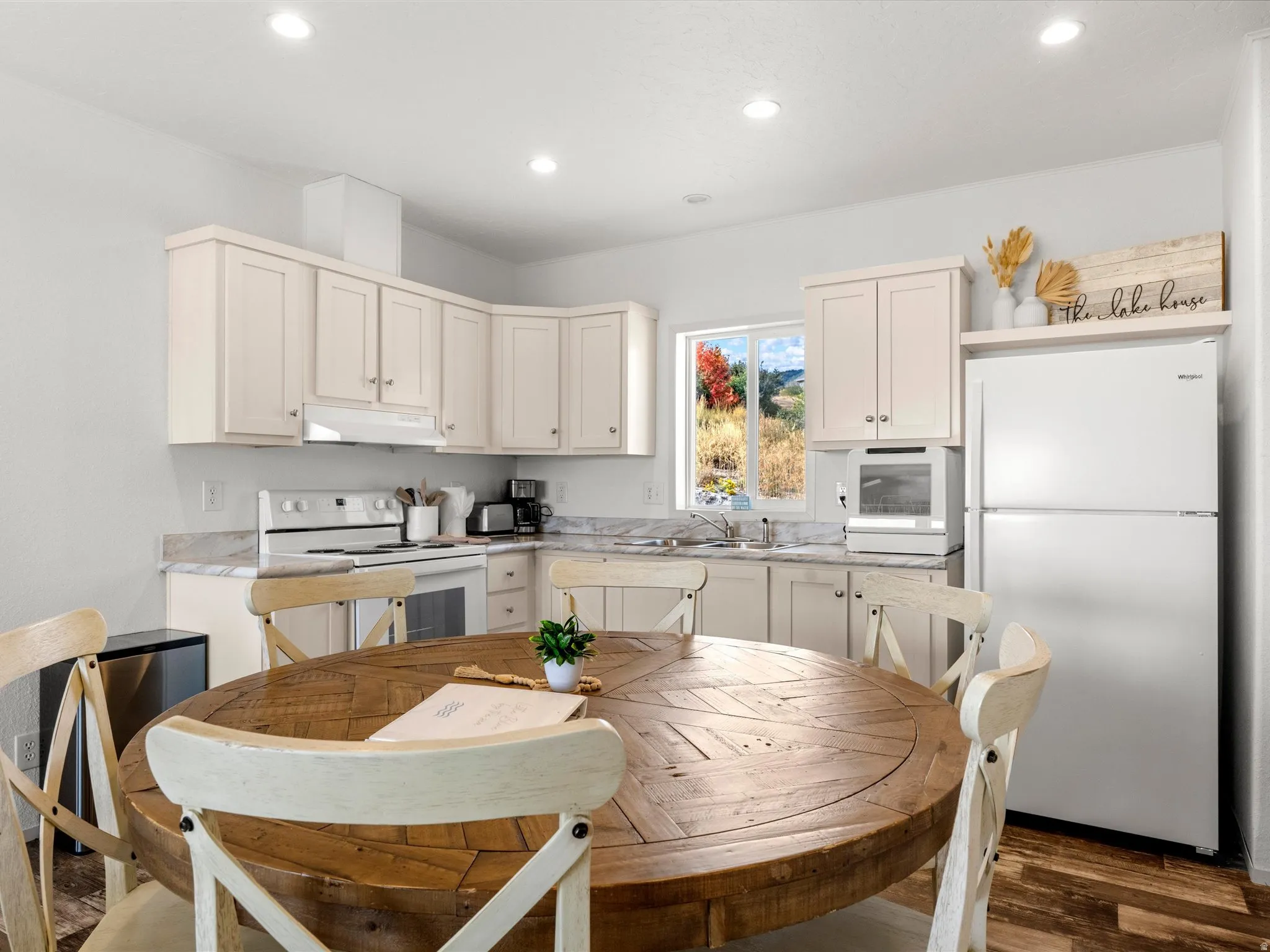 Kitchen featuring light-toned cabinetry, light-toned countertops, and a built-in range