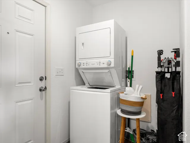 laundry with stacked washer and dryer