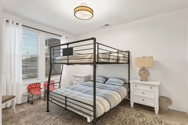 Light wood-finish flooring with a flush-mount ceiling light fixture