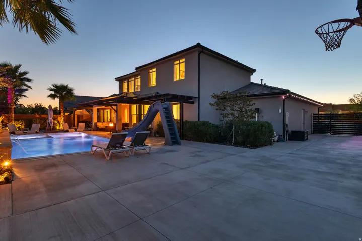 Two-story stucco exterior with a multi-level roofline