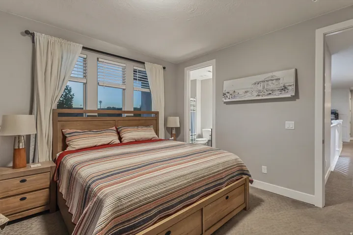 Carpet flooring and a light neutral wall color create a calming atmosphere