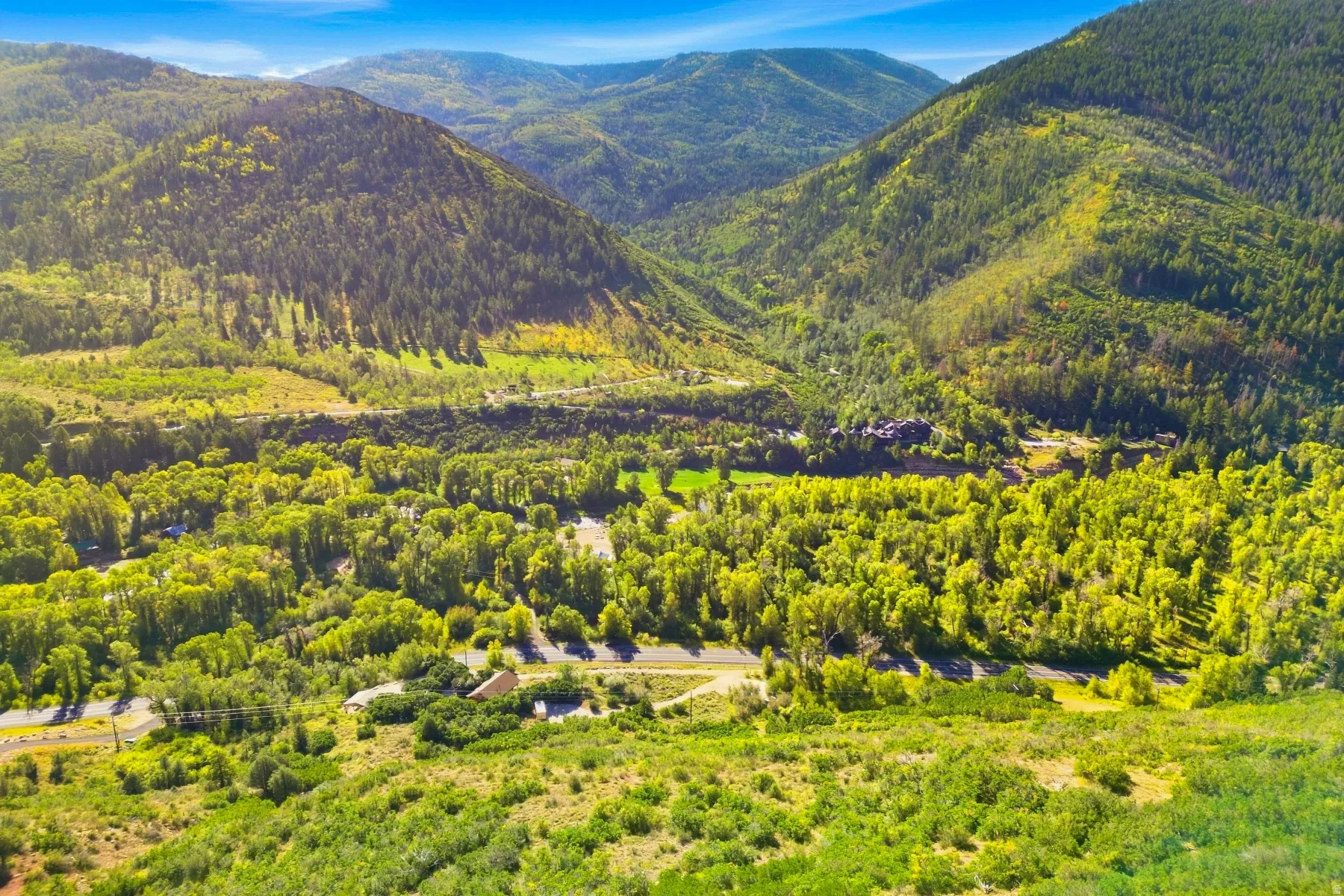 Expansive mountainous terrain with lush green foliage