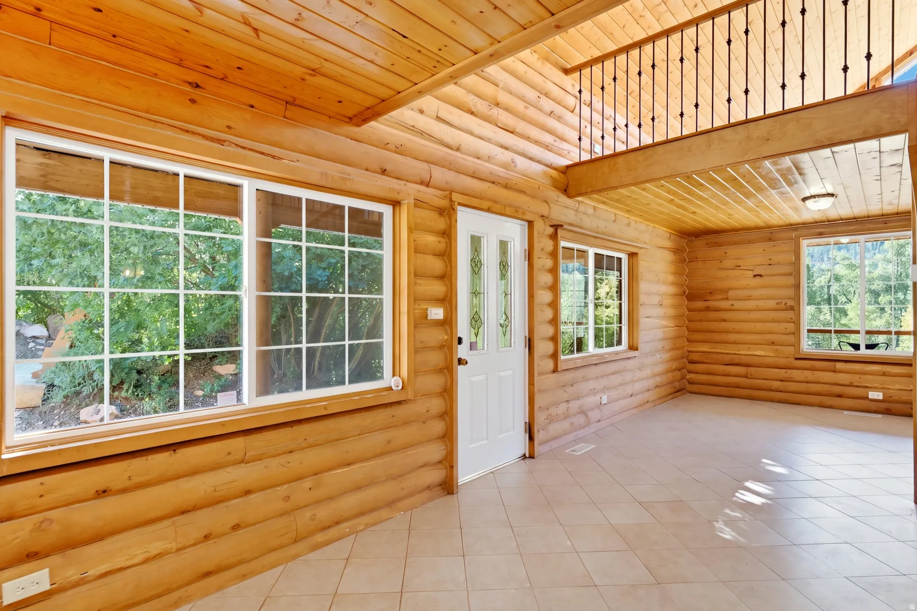 Log construction with exposed wood-finish walls and ceilings