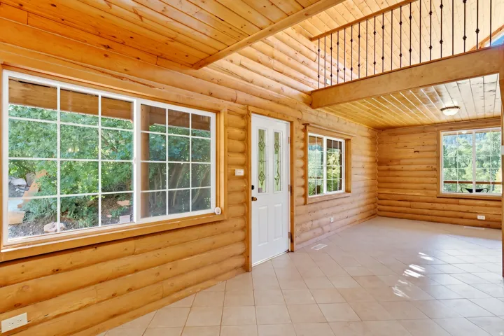 Log construction with exposed wood-finish walls and ceilings