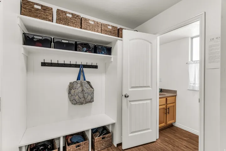 Built-in shelving with storage cubbies and coat hooks