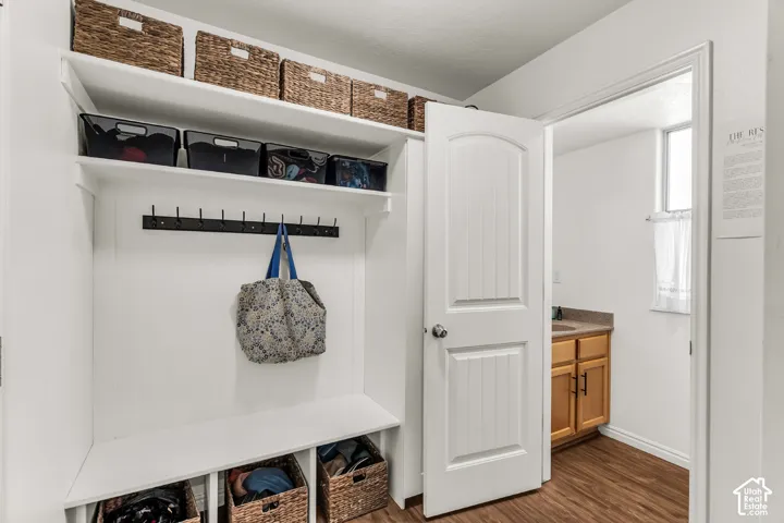 Built-in shelving with storage cubbies and coat hooks