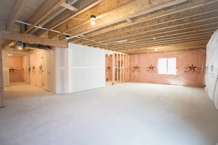 Unfinished basement with potential for large family/game room, full bathroom and one bedroom.