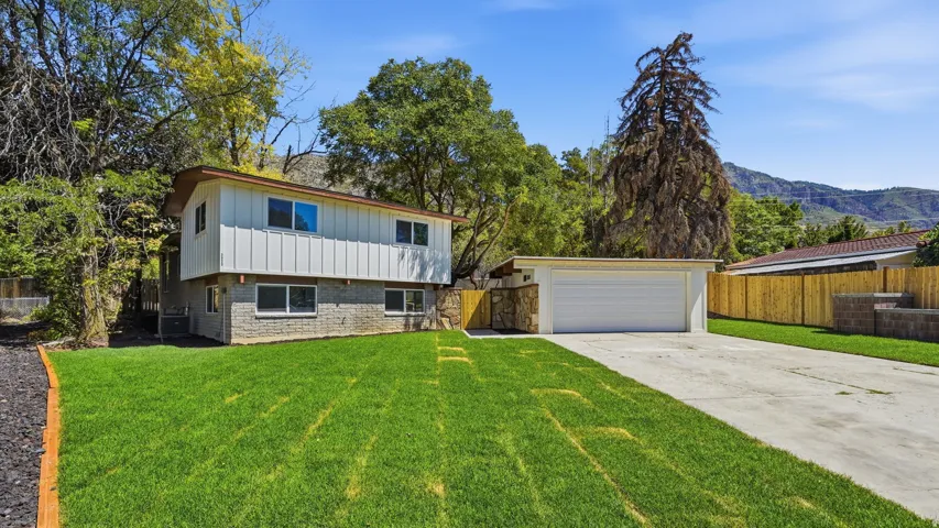 Two-story exterior with a garage and driveway
