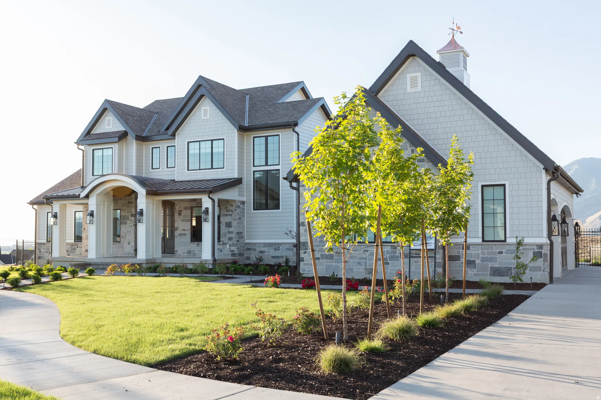 Stone and siding exterior with a multi-gabled roofline
