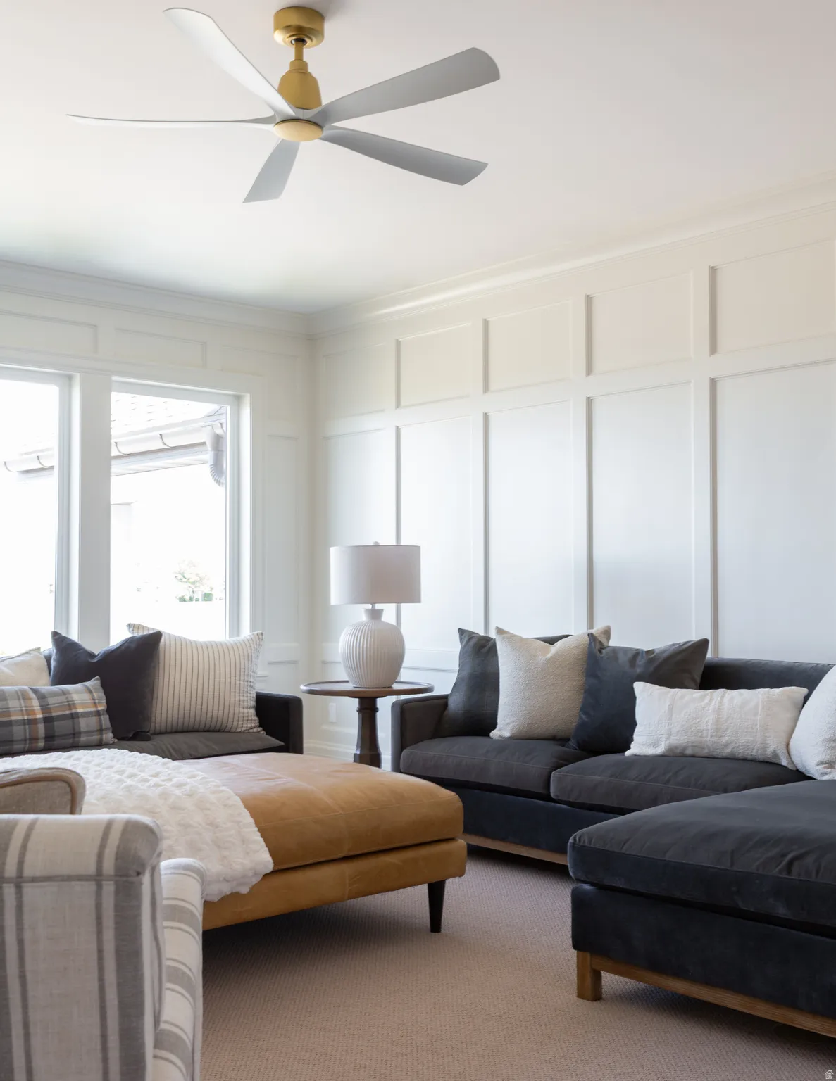 Ceiling fan with gold-tone hardware and light gray blades
