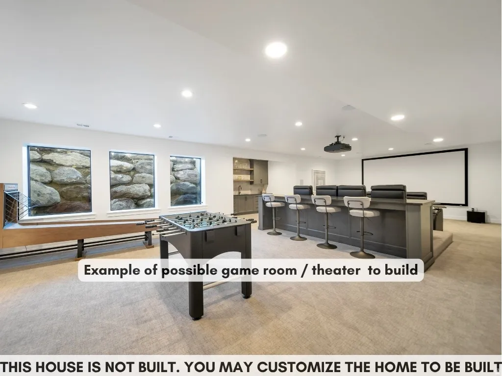 Recessed lighting, built-in wet bar with shelving, integrated projection screen, and three transom windows
