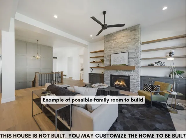 Stone-clad fireplace with a wood mantle, built-in shelving, wood-finish flooring, and a contemporary ceiling fan