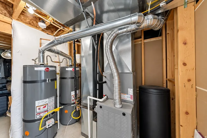 Dual water heaters, furnace system, water softener, and visible ductwork