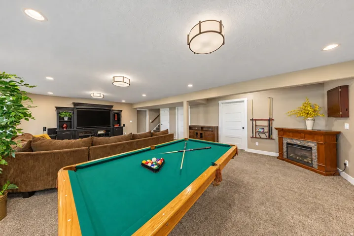 Spacious room with recessed lighting and a ceiling-mounted fixture