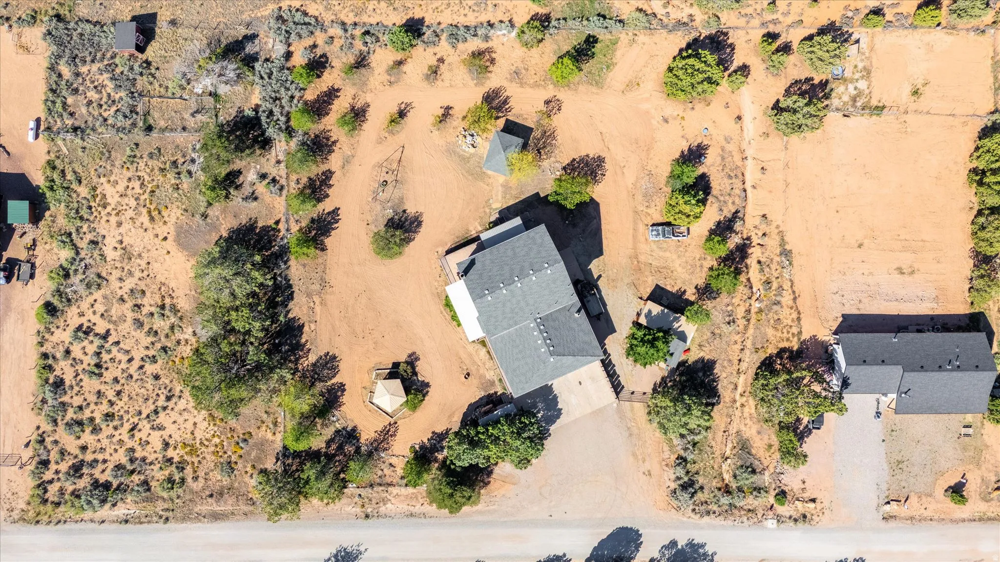 Expansive property featuring a main residence, a detached secondary structure, and a gazebo