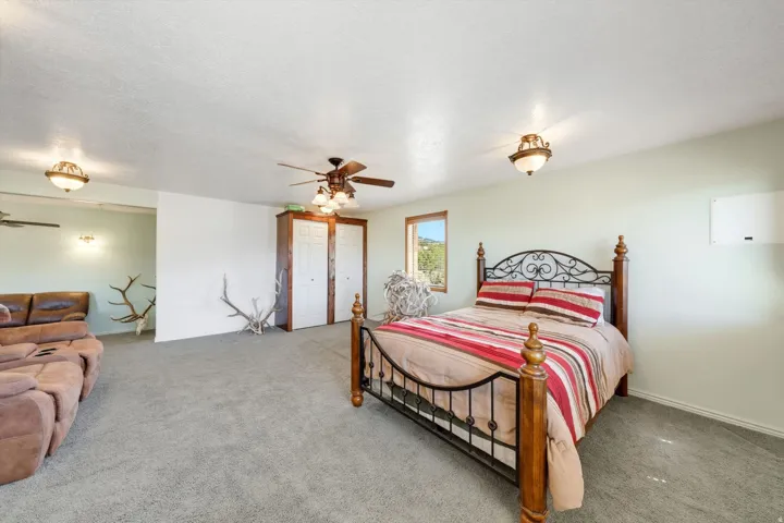 Wall-to-wall carpeting and multiple ceiling fans