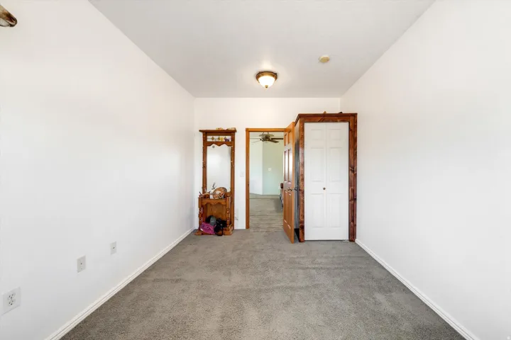 Wall-to-wall carpeting with white walls