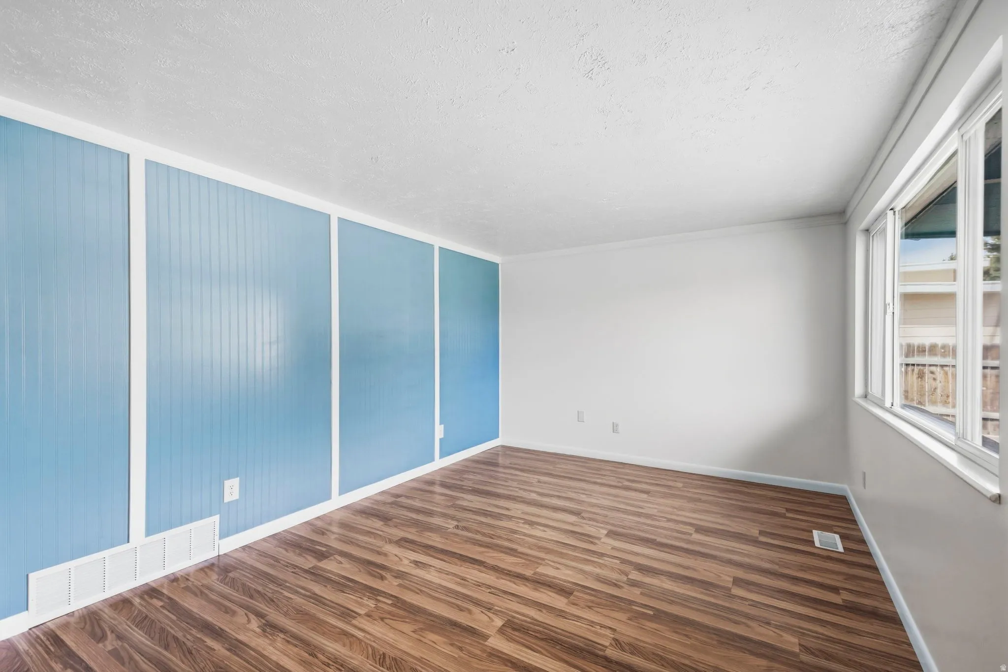 Wood-finish flooring with a light-colored ceiling