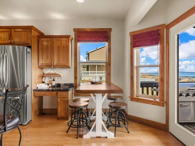 Wood-finish flooring with natural wood cabinetry and trim