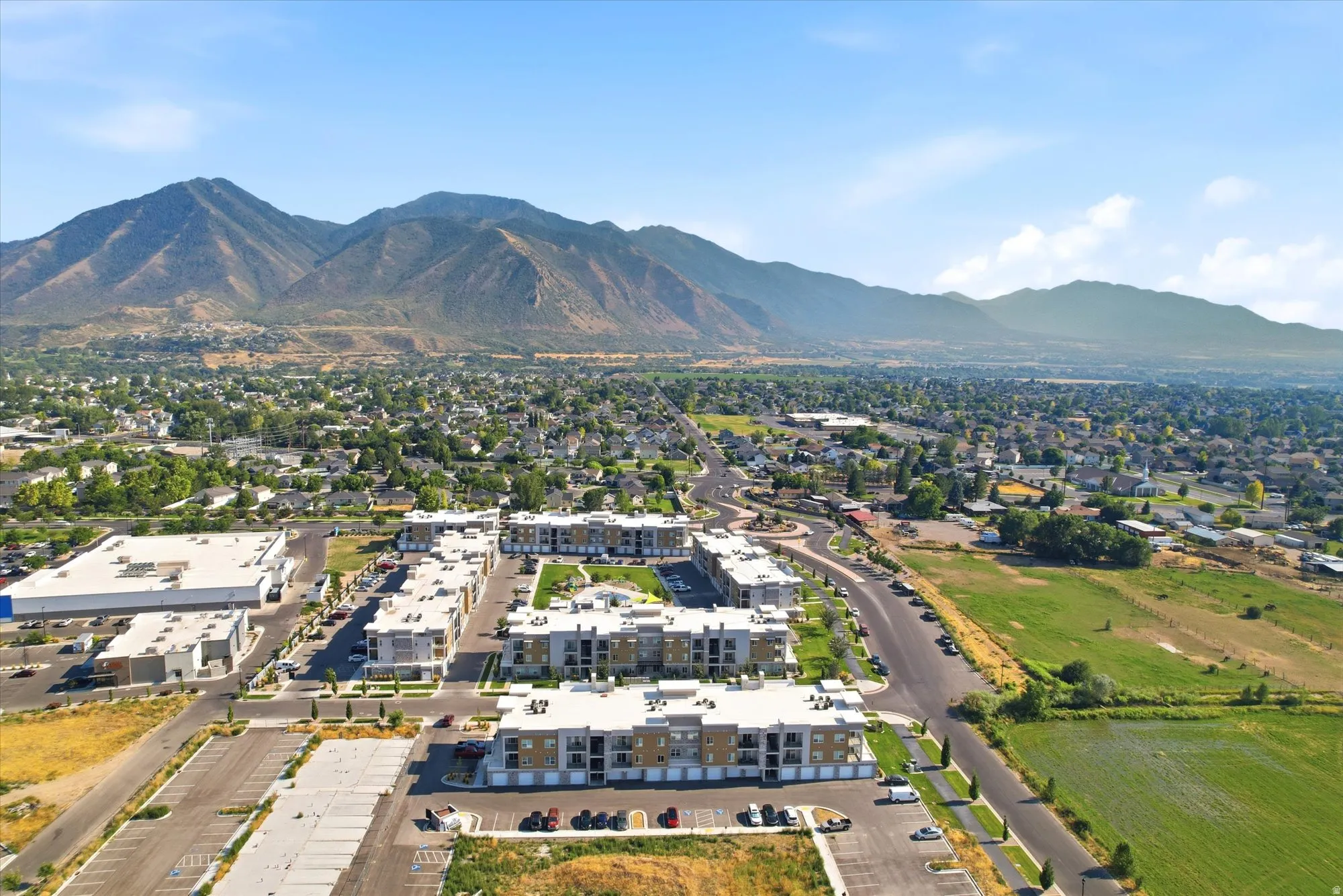 Mountain backdrop and expansive residential area with multiple multi-story structures