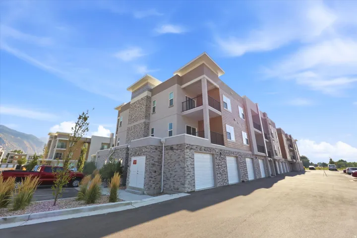 Multi-story building featuring stone veneer and horizontal siding