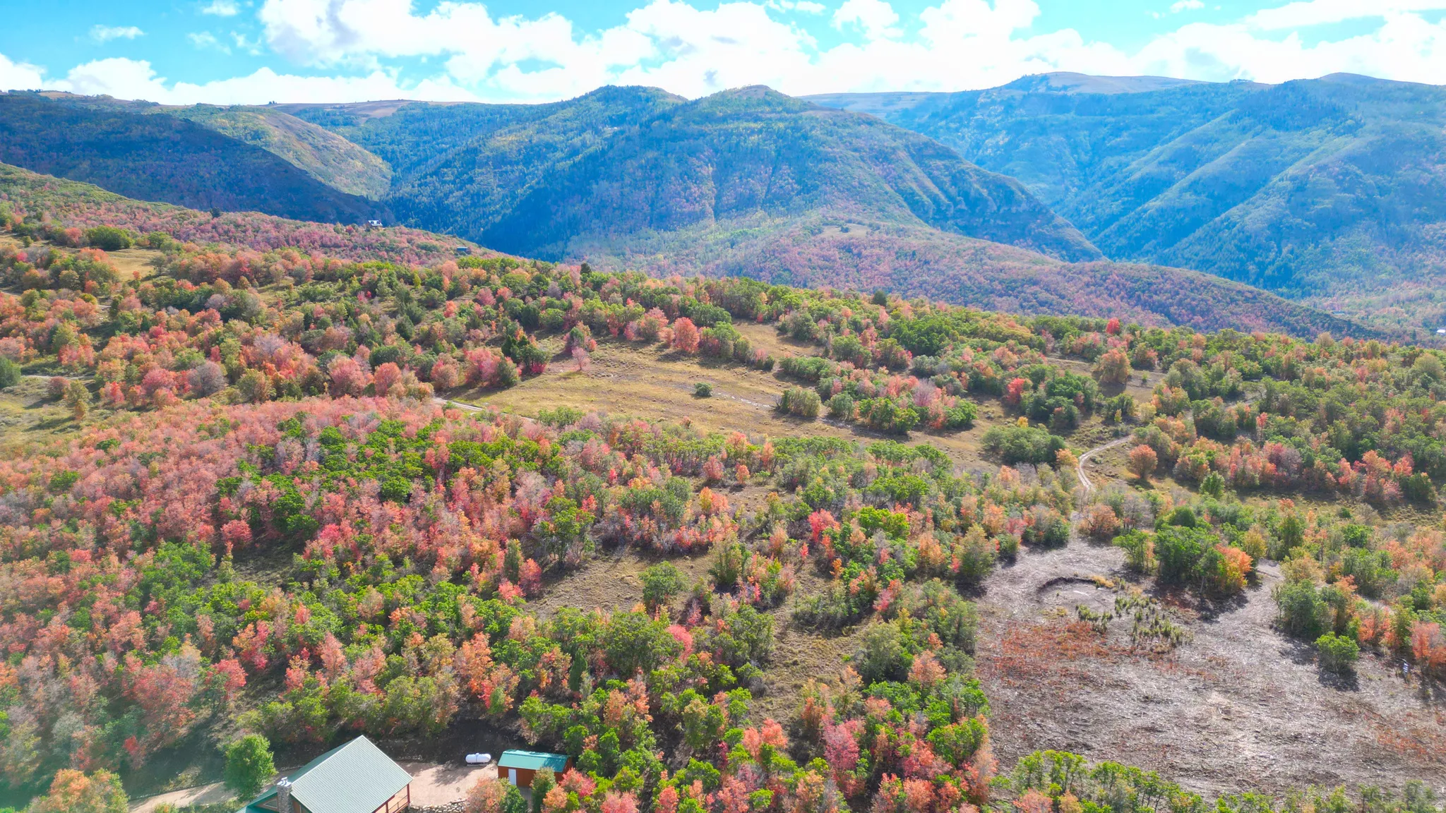 Expansive mountainous terrain with varied foliage