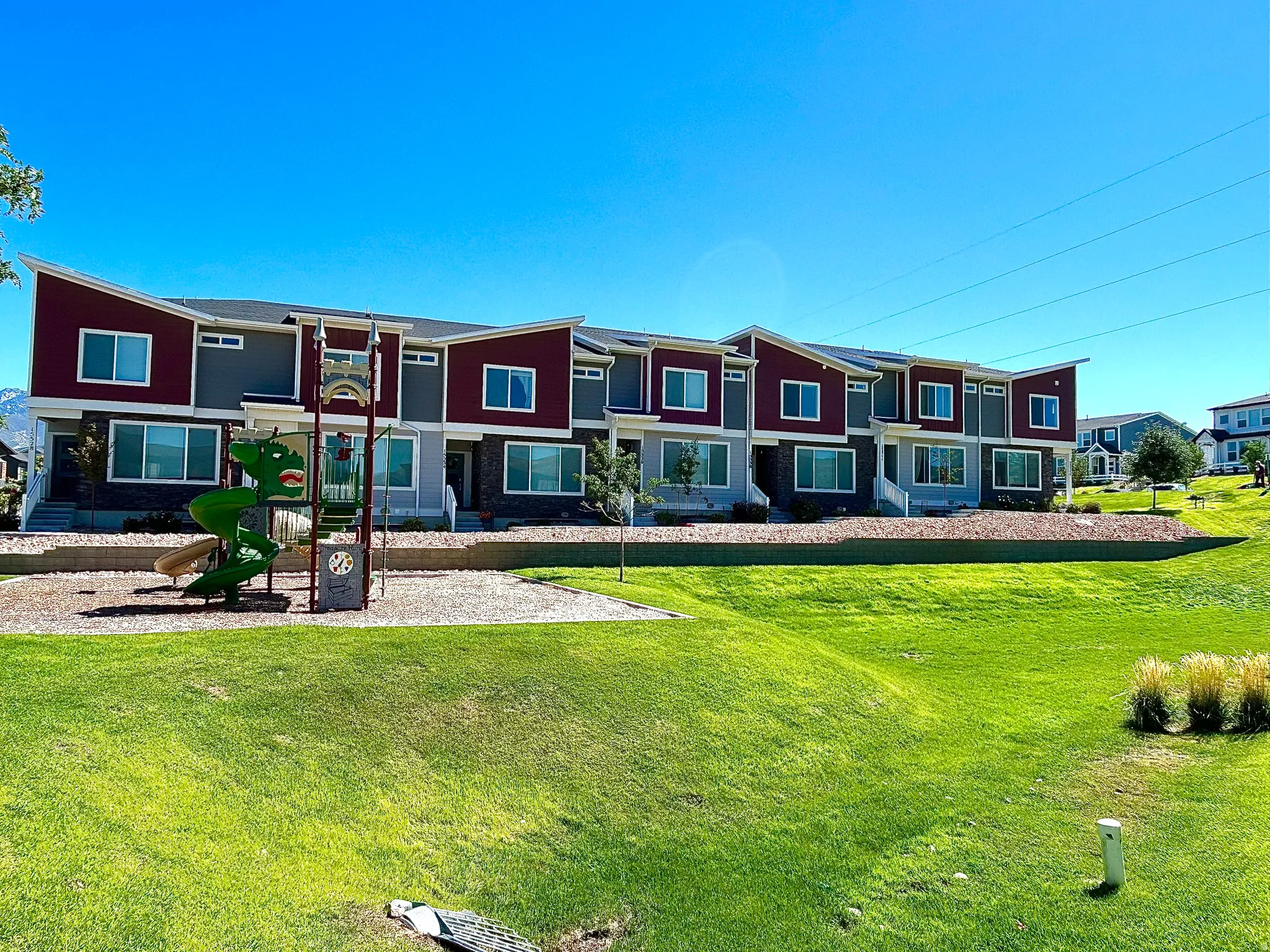 Contemporary townhome exteriors featuring multiple windows and a distinct architectural design