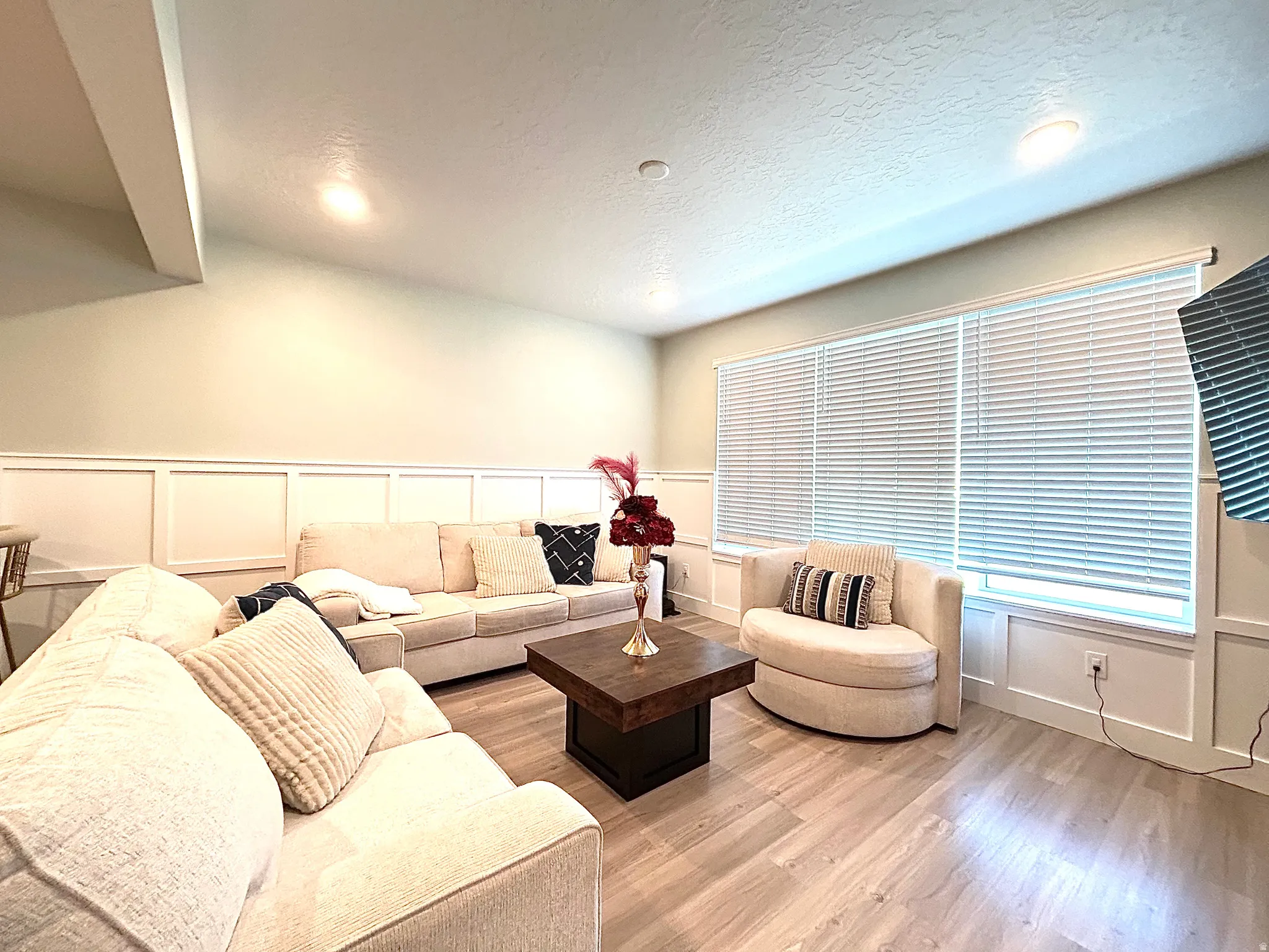 Recessed lighting, wood-finish flooring, and wainscoting