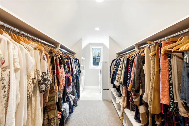 Recessed lighting, built-in shelving, window, and carpeted flooring
