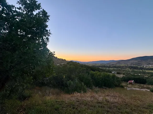 Expansive natural landscape with varied topography and distant mountainous terrain