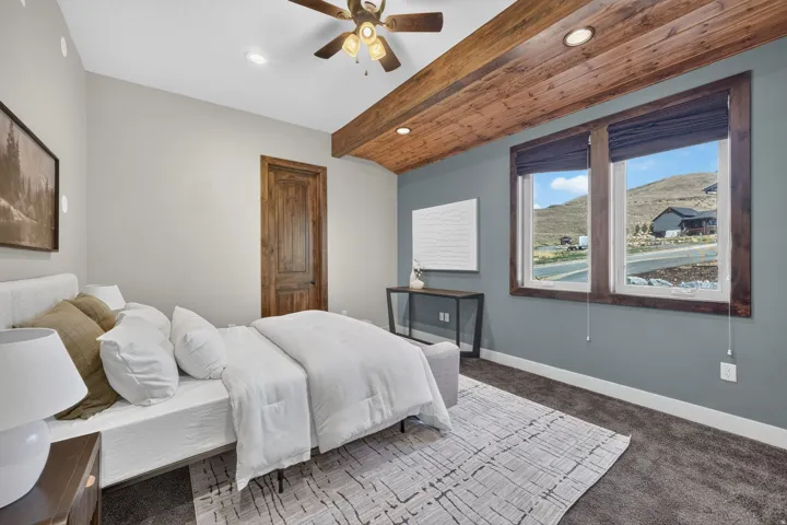 Wood-beamed ceiling with recessed lighting
