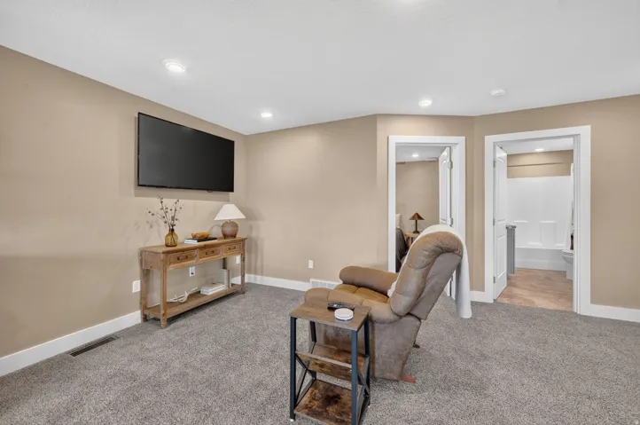 Recessed ceiling lighting, wall-mounted display, and two interior doors