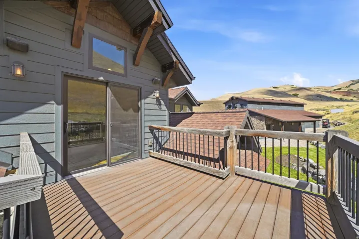 Spacious outdoor deck with wood-finish flooring and durable railings