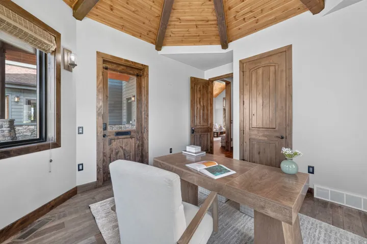 Wood-finish vaulted ceiling with exposed beams