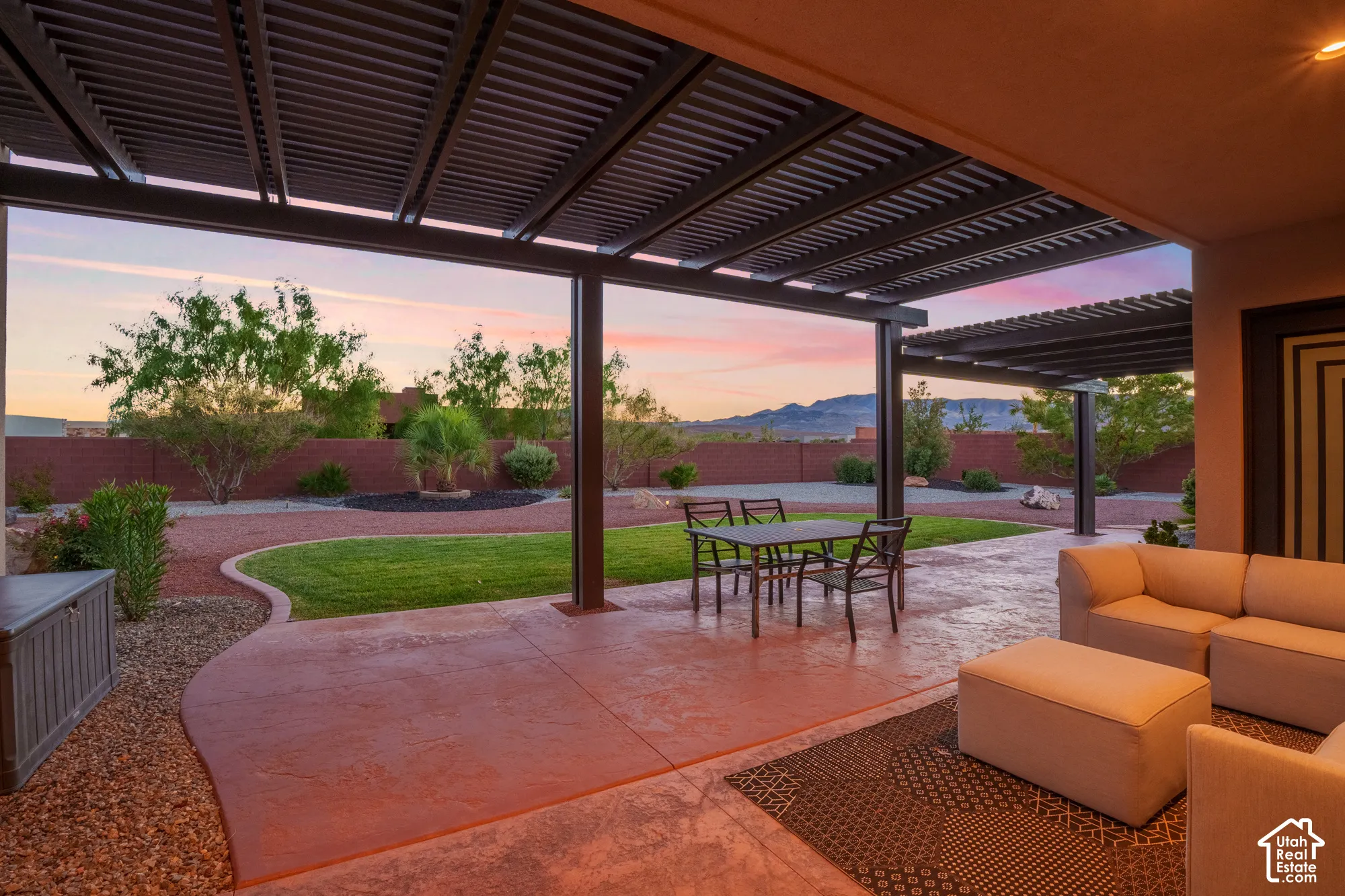 Expansive covered patio with a slatted pergola roof