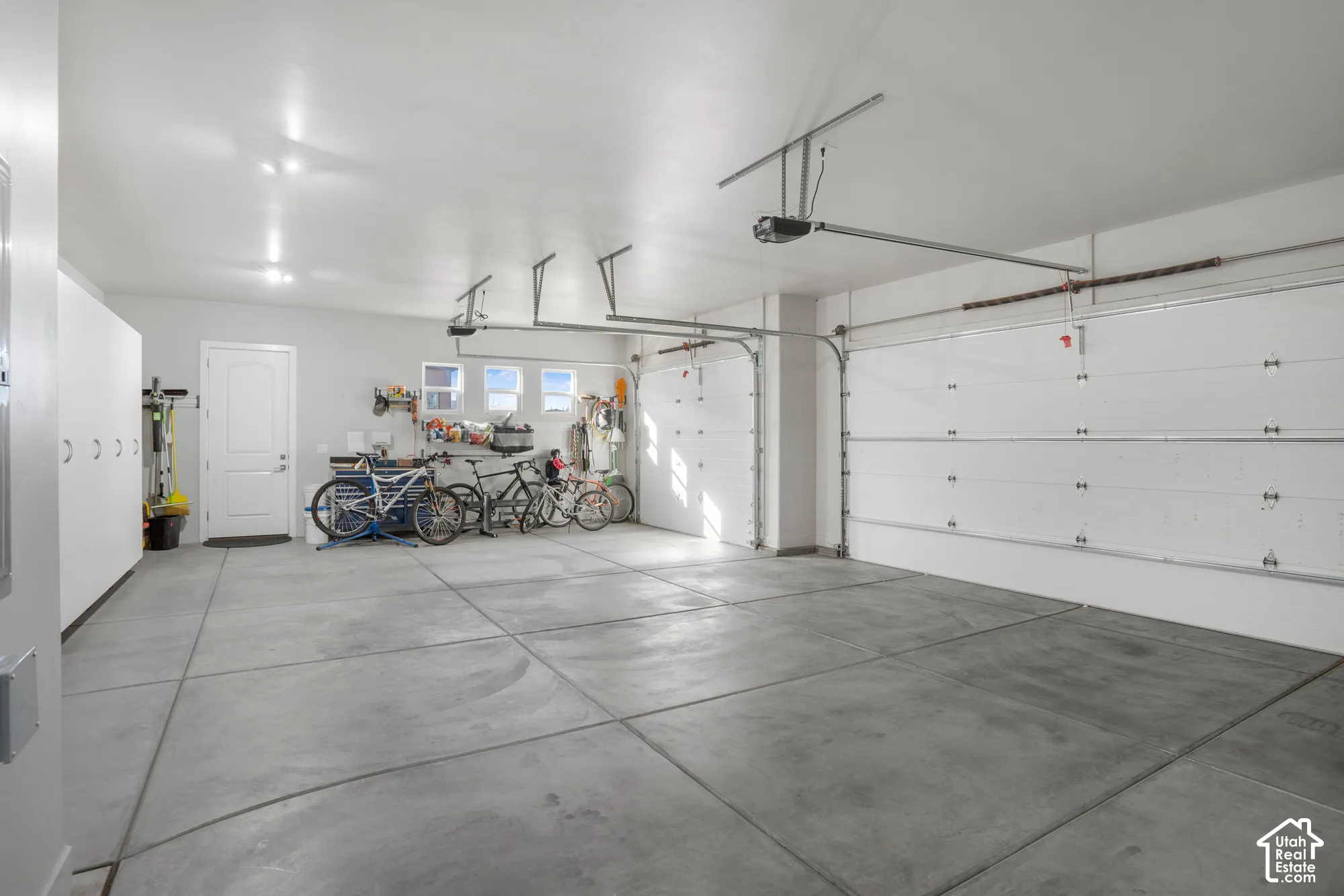 Multiple garage doors with automatic openers