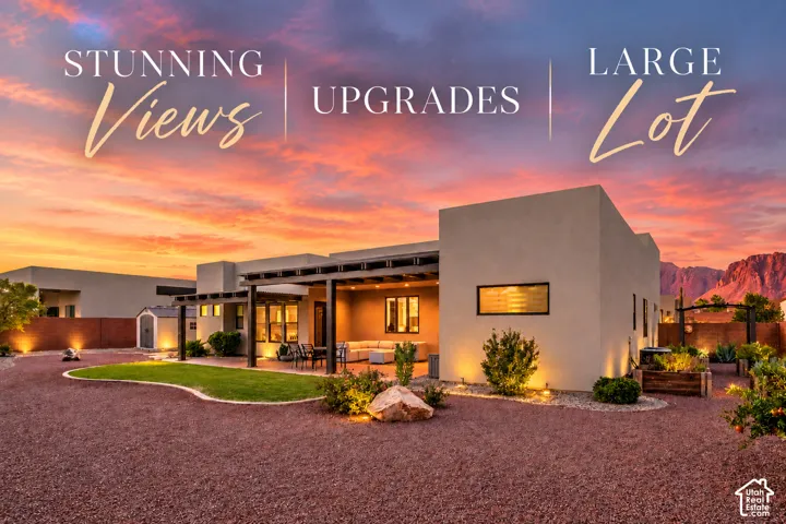 Exterior featuring a covered patio, xeriscaped landscaping, and a separate storage shed